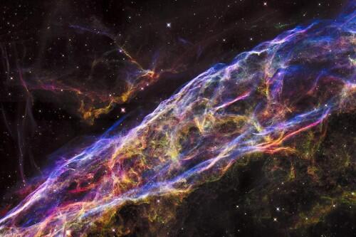 A small section of the expanding remains of the Veil Nebula, a massive star that exploded about 8,000 years ago. The entire nebula is 110 light-years across, covering six full moons on the sky as seen from Earth, and resides about 2,100 light-years away in the constellation Cygnus, the Swan. REUTERS/NASA/ESA/Hubble Heritage Team