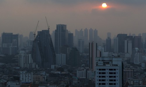 A partial solar eclipse is seen in Bangkok, Thailand, March 9, 2016. REUTERS/Athit Perawongmetha