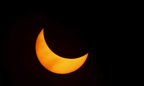 A solar eclipse is seen from the beach of Ternate island, Indonesia, March 9, 2016. REUTERS/Beawiharta