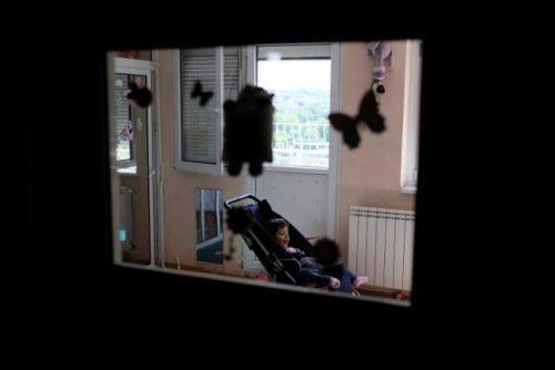 A child with disabilities sits in a stroller at the Centre for the Protection of Infants, Children and Youth in Belgrade, Serbia June 8, 2016.  REUTERS/Marko Djurica