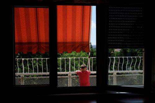 A child with disabilities looks out from a terrace at the Centre for the Protection of Infants, Children and Youth in Belgrade, Serbia June 8, 2016.  REUTERS/Marko Djurica