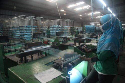 Workers prepare yarn at the A to Z Textile Mills factory producing insecticide-treated bednets in Arusha, Tanzania, May 10, 2016. REUTERS/Katy Migiro