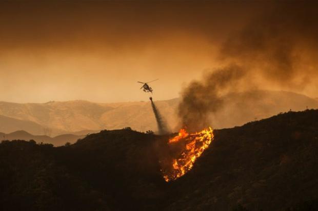 Southern California fire mushrooms, residents evacuated