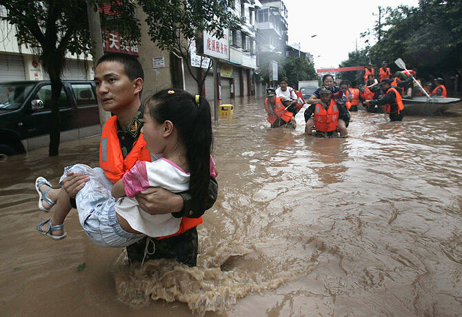 China floods leave more than 100 dead or missing