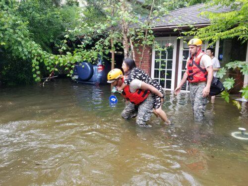 Texas National Guard soldiers aid stranded residents in heavily flooded areas from the storms of Hurricane Harvey in Houston, Texas, U.S., August 27, 2017. Lt. Zachary West, 100th MPAD/Texas Military Department/Handout via REUTERS ATTENTION EDITORS - THIS IMAGE WAS PROVIDED BY A THIRD PARTY