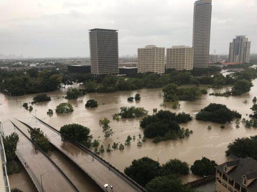 Flooded downtown is seen from a high rise along Buffalo Bayou after Hurricane Harvey inundated the Texas Gulf coast with rain causing widespread flooding, in Houston, Texas, U.S. August 27, 2017 in this picture obtained from social media. Mandatory credit: Twitter/@caroleenarn via REUTERS ATTENTION EDITORS - THIS IMAGE HAS BEEN SUPPLIED BY A THIRD PARTY. MANDATORY CREDIT. NO RESALES. NO ARCHIVES