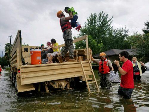 Texas National Guard soldiers aid residents in heavily flooded areas from the storms of Hurricane Harvey in Houston, Texas, U.S., August 27, 2017 Lt. Zachary West, 100th MPAD/Texas Military Department/Handout via REUTERS ATTENTION EDITORS - THIS IMAGE WAS PROVIDED BY A THIRD PARTY