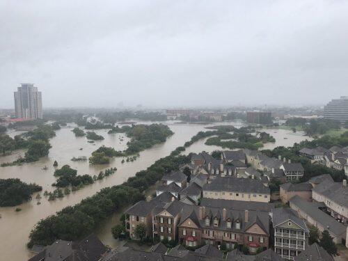 Flooded downtown is seen from a high rise along Buffalo Bayou after Hurricane Harvey inundated the Texas Gulf coast with rain causing widespread flooding, in Houston, Texas, U.S. August 27, 2017 in this picture obtained from social media. Mandatory credit: Twitter/@caroleenarn via REUTERS ATTENTION EDITORS - THIS IMAGE HAS BEEN SUPPLIED BY A THIRD PARTY. MANDATORY CREDIT. NO RESALES. NO ARCHIVES